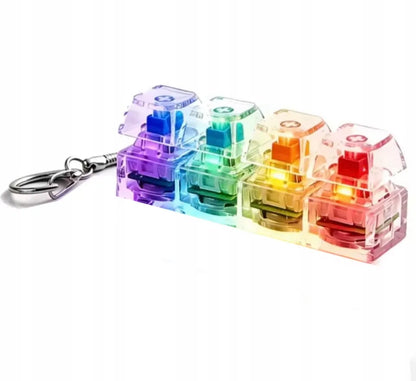 4 klavišų „clicker“ tipo antistresinis žaislas, klaviatūros imitacija, raktų pakabukas